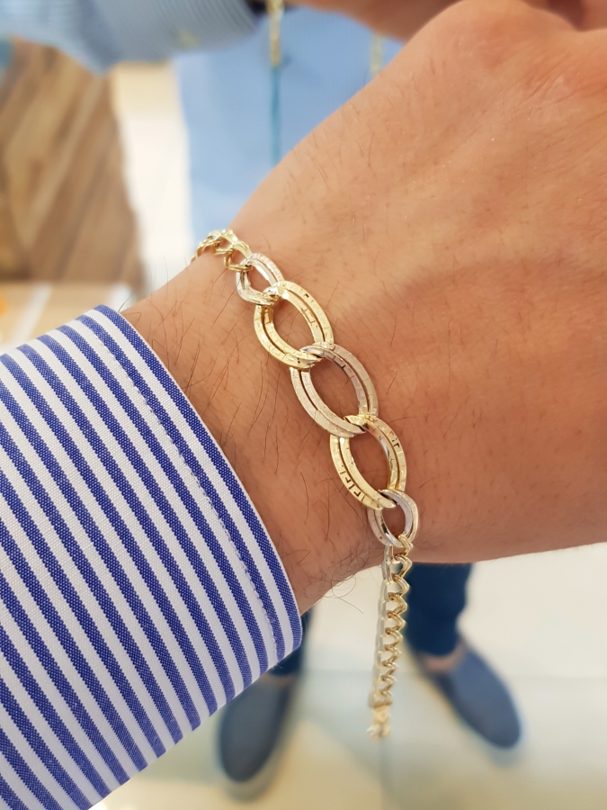 Bracciale a maglie ondulate con greca in oro giallo 18kt